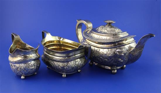 A George III matched silver three piece tea set, gross 34 oz.